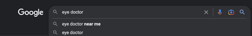 Screenshot of the Google search bar with the term "eye doctor" typed in.