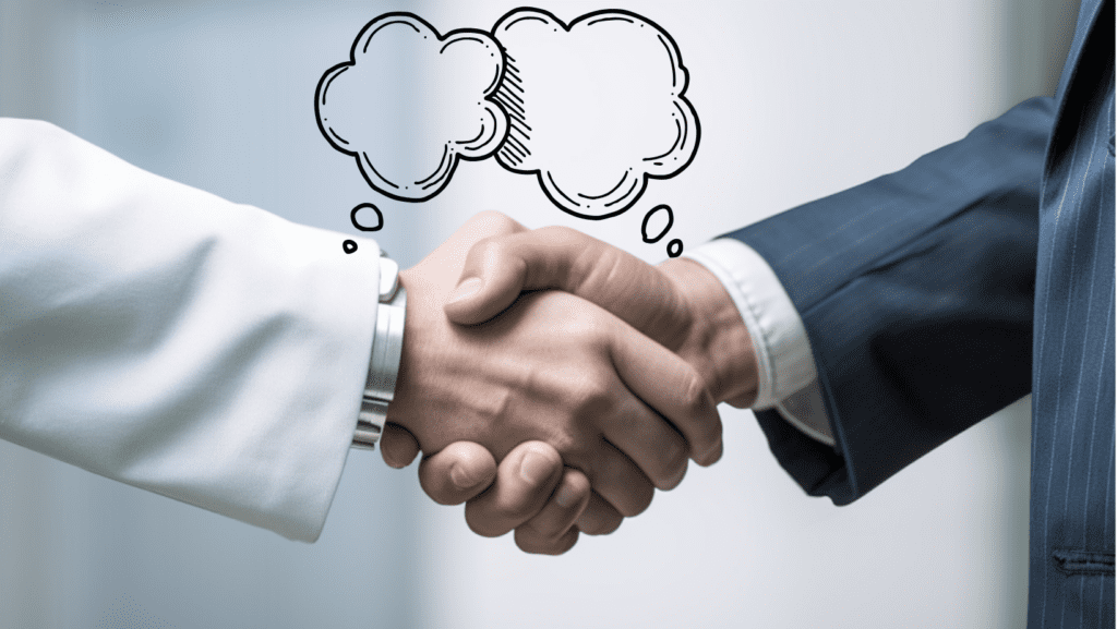 A closeup of two people shaking hands with a white background. Illustrated idea bubbles however over the hands.